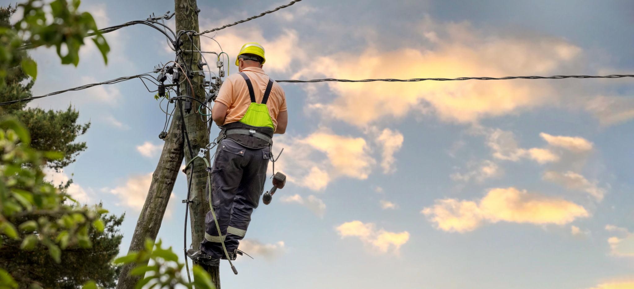 Lineman working in difficult weather conditions
