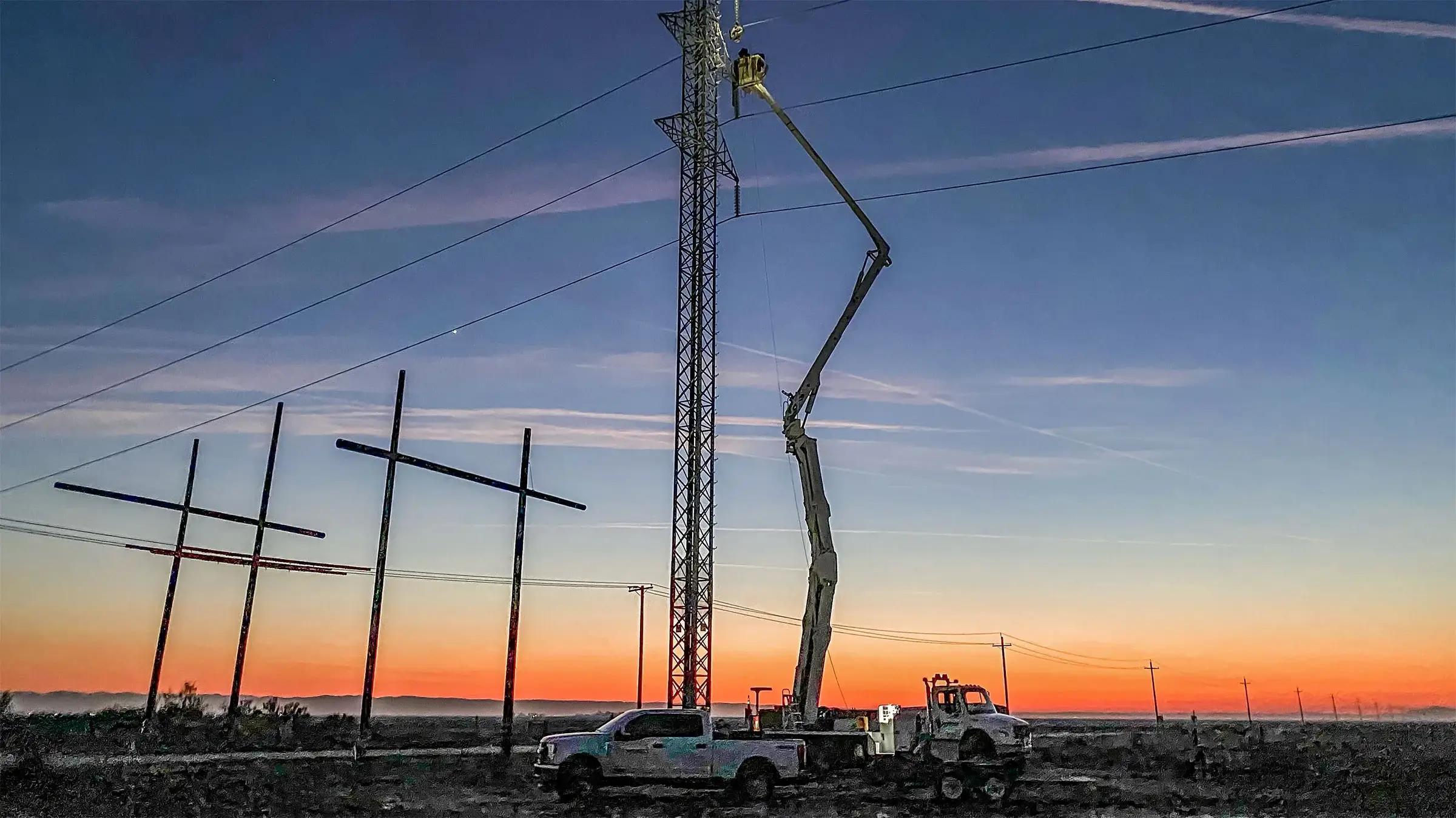 Utility worker using a bucket truck
