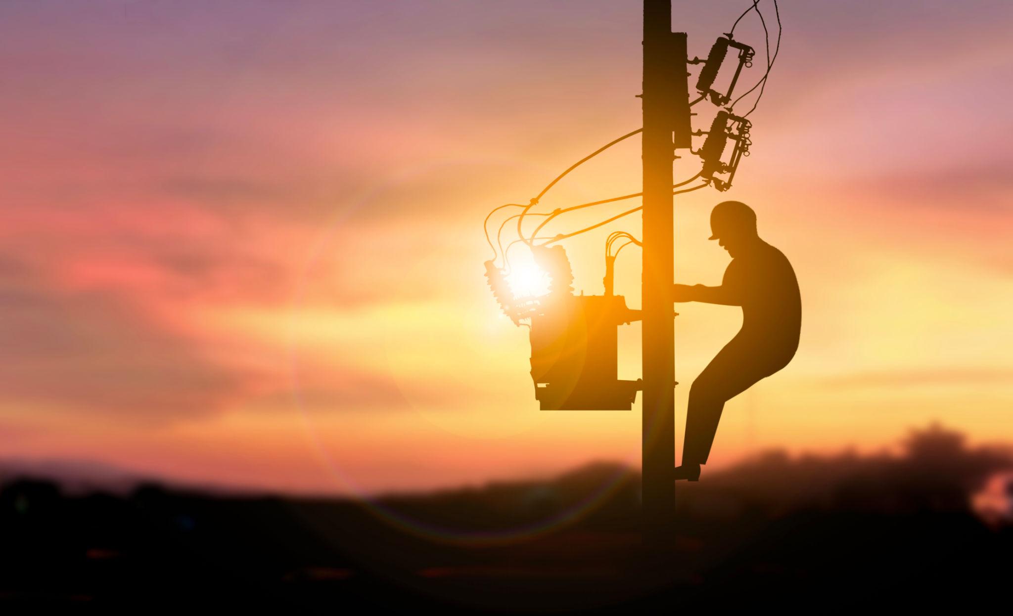 Lineman working near power lines
