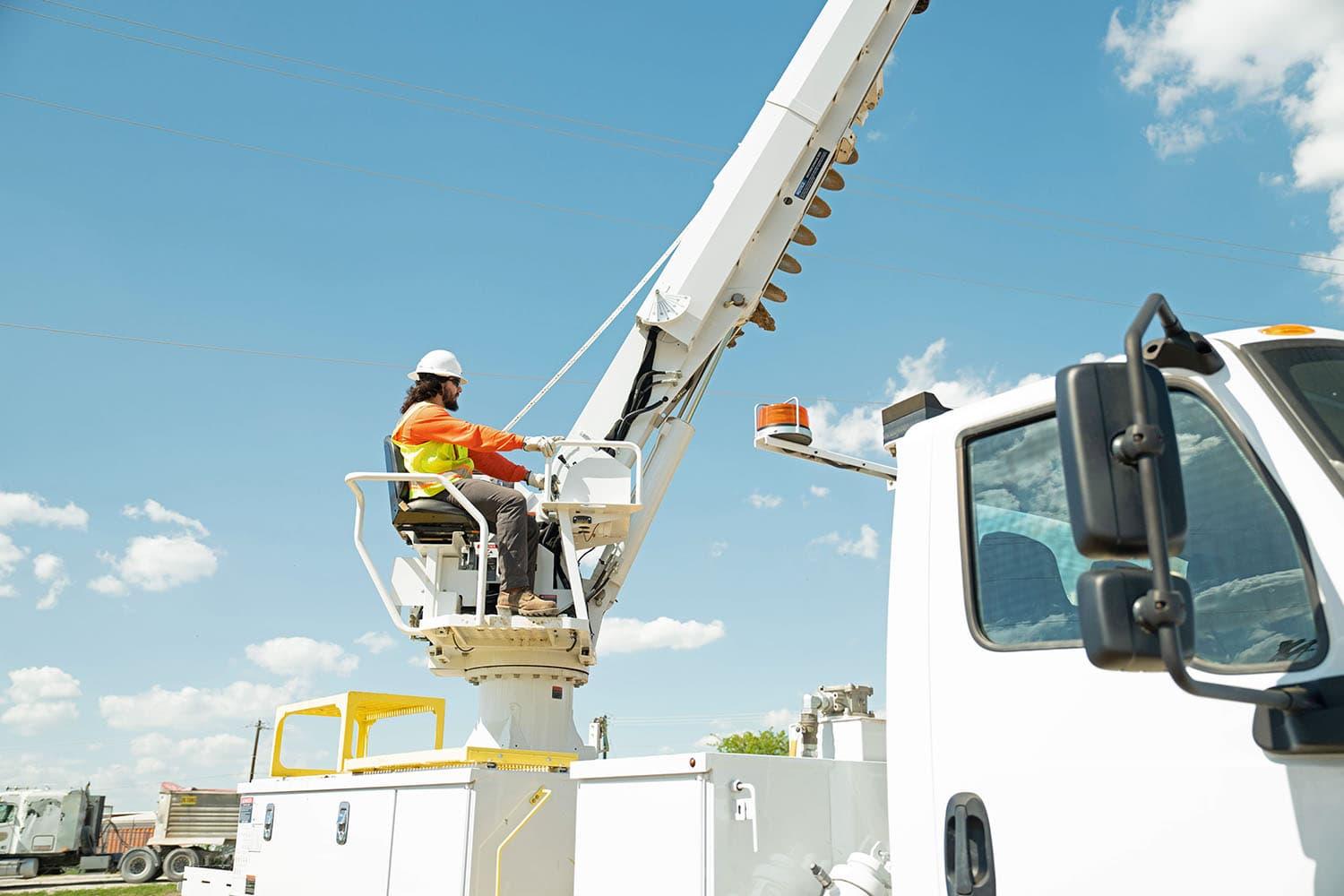 Utility storm work and lineman truck during power restoration