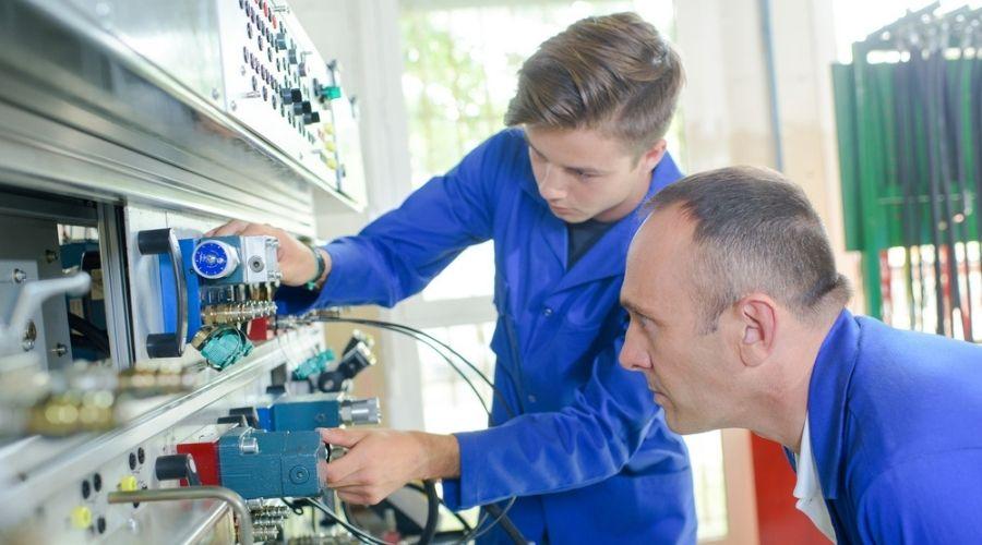 Electrician working on an electrical panel in a career resistant to AI automation