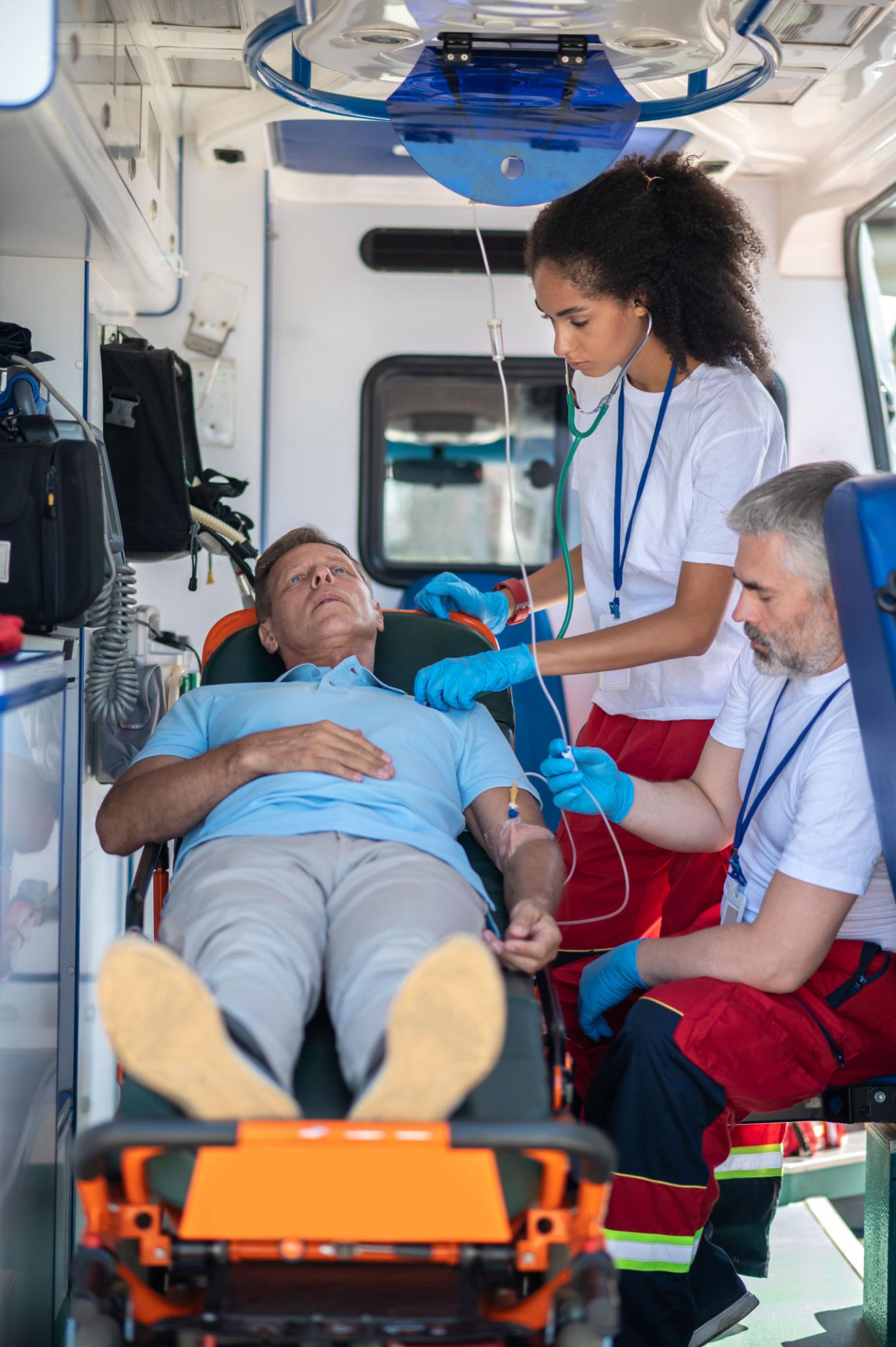 Paramedic providing emergency medical care during a 911 response