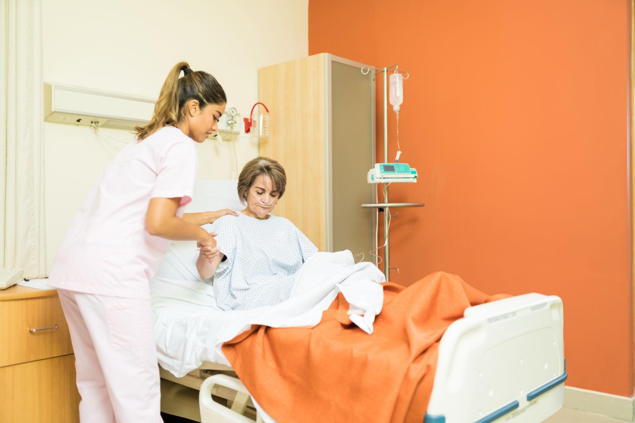 Registered nurse caring for a patient in a healthcare setting