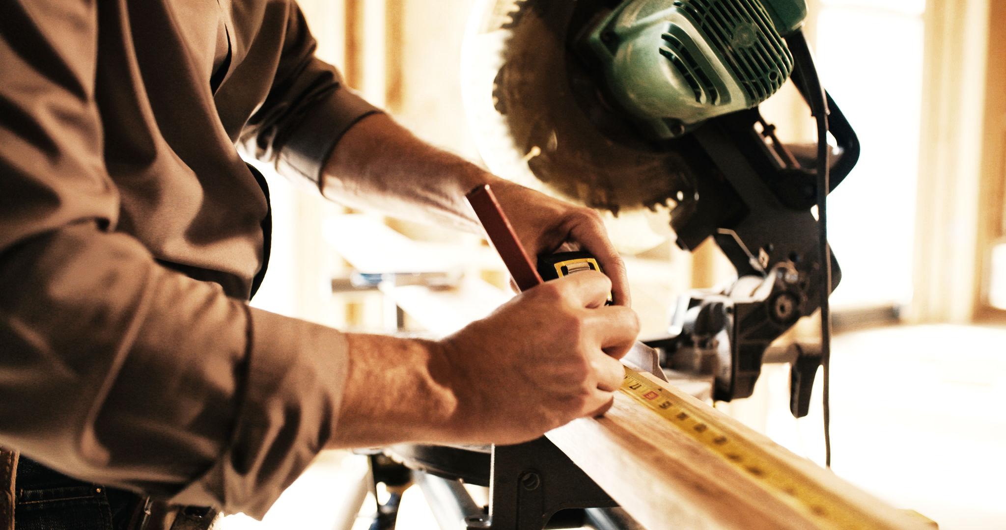 Skilled carpenter performing custom woodworking and construction